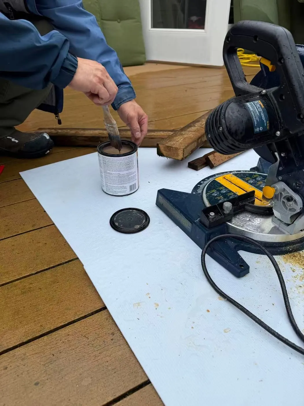 Hands, tools and materials during a deck screen repair